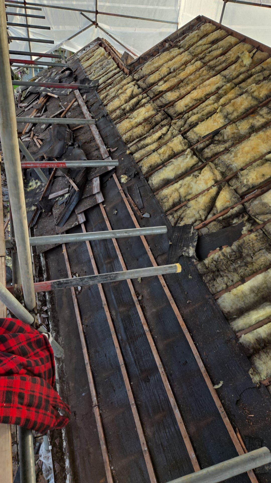 Old roofing felt and battens removed during full roof replacement Folkestone